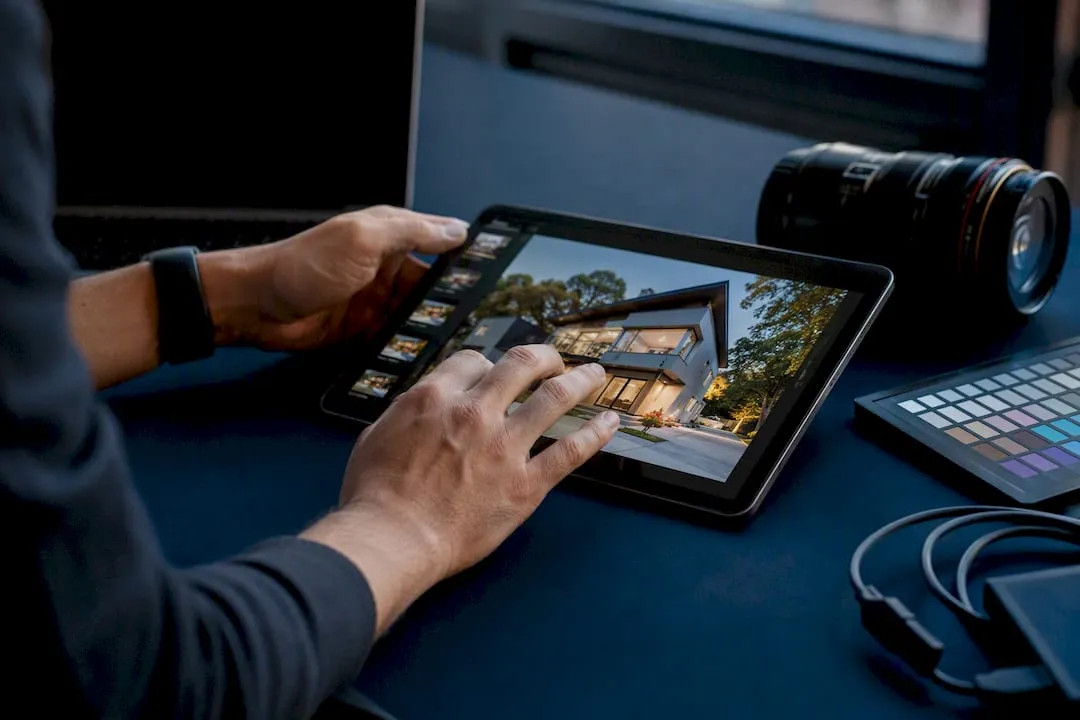 Hands compressing real estate listing photos