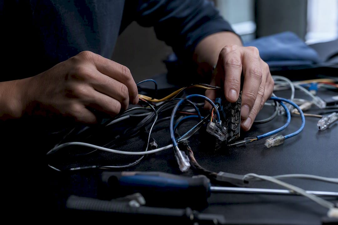 Hands auditing network cables and hardware